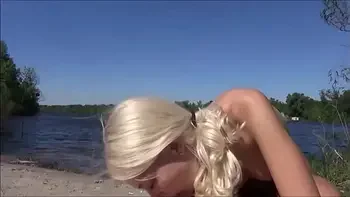 Curvy blonde was riding a dick on public beach