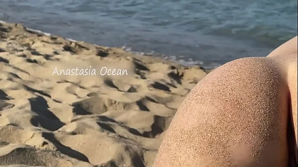PUBLIC BEACH - Everyone watches how she spread her legs in public. Flashing with her pussy outside.