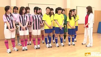 Japanese female team listen and take a lesson from their coach