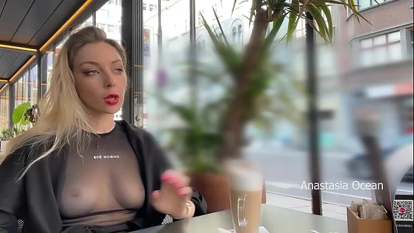 Flashing tits in cafe with glass walls so all people outside see me. Transparent t-shirt no bra.