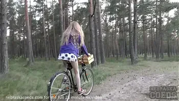 skinny areana fox riding a bicycle nude outdoors in a forest and masturbating
