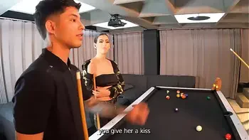 A threesome with two fiery Latinas on a pool table.