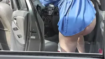 In dressing gown without panties pretty sexy blonde Milf Frina cleans interior of her car in courtyard of house. No panties in public. Nude in public. Public exposure. Public nudity. Publicly. Naked in public. Solo MILF. Outdoor. Outside. No panties. Ass