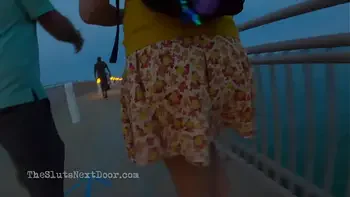 Double handjob on public beach