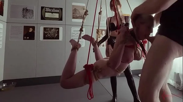 Submissive bondage puppet Rebel Rhyder sucks cock and eats ass in a demented threesome game