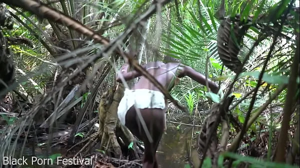 Skinny African tribe woman working outdoor