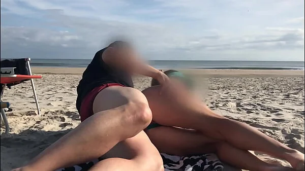 Getting a dick in her ass in front of everyone was the last thing she expected while lying on a public beach...