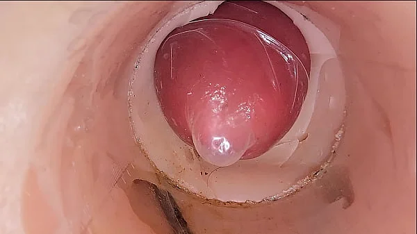 The camera in the deep pussy records a huge ejaculation of sperm into the condom