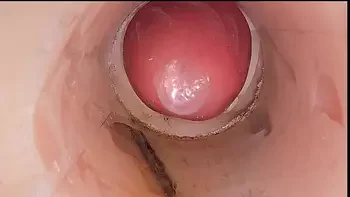 The camera in the deep pussy records a huge ejaculation of sperm into the condom