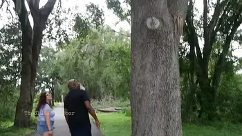 Nerdy Milf strokes and suck blk dick in the Park