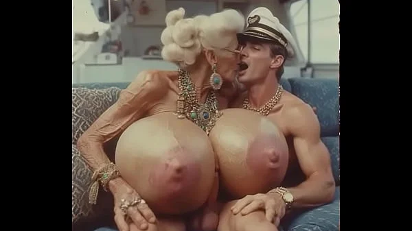 JAY7 Granny Boob Cruise 01 - AI VIDEO - A topless and horny granny with huge bolt-on tits gives a crazy titjob to the skipper