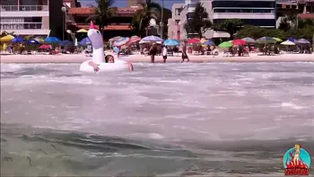 my husband, my unicorn and me in erotic play on a public beach.