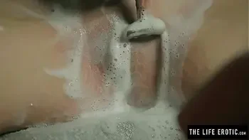 Horny milf shaves and squirts to orgasm while held in a basement