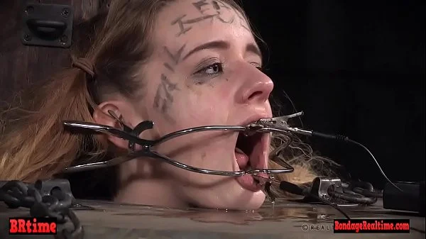 Bdsm babe trapped in a barrel and electrified