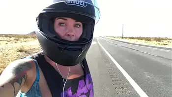 felicity feline riding on aprilia tuono motorcycle