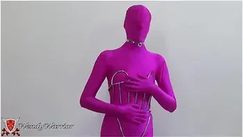 My Iron Maiden Corset Is Locked Over A Pink Zentai