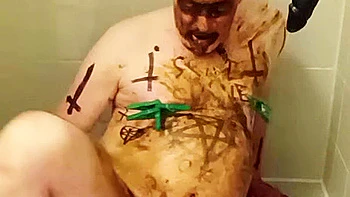 Satan slave takes perverted enema treatment