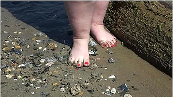 Fat Bare Legs With Red Pedicure Walk Along The Bank Of The River, Fetish