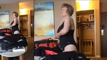 Sexy Grandma is Sexy at 66 in a black swimsuit