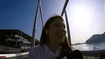 Talia Mint plays in public with remote control toy over the phone with fan