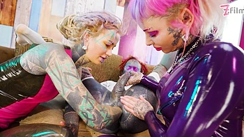 Tattooed trans Lily Lu gets two fists up her ass