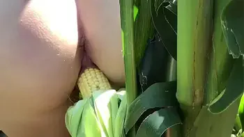 Riley Jacobs playing in corn field