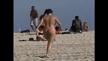 Exhibitionist Wife 19 - Anjelica teasing random voyeurs at a public beach by flashing her shaved cunt!