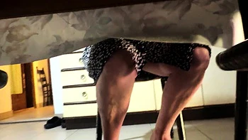 My mother in law spreads her beautiful legs under the table