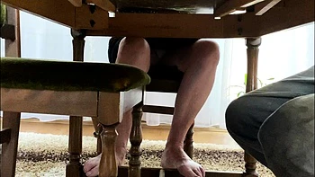 My mother in law spreads her legs under the desk