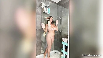 Showering chick Lady Lyne is touching her pussy in the morning
