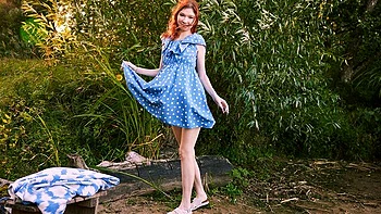 Lusty naked redhead Mia Murkovski is touching her shaved pussy