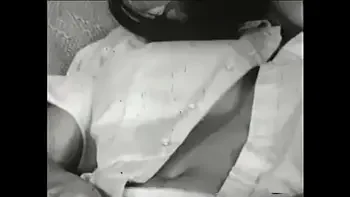 Watch young vintage brunette with round melons masturbate in old porn movie