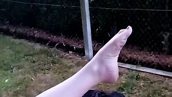 Big-boobed granny masturbates outdoors at party
